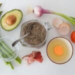 A selection of healthy foods laid out on a table. The colours are bright and the food looks delicious.