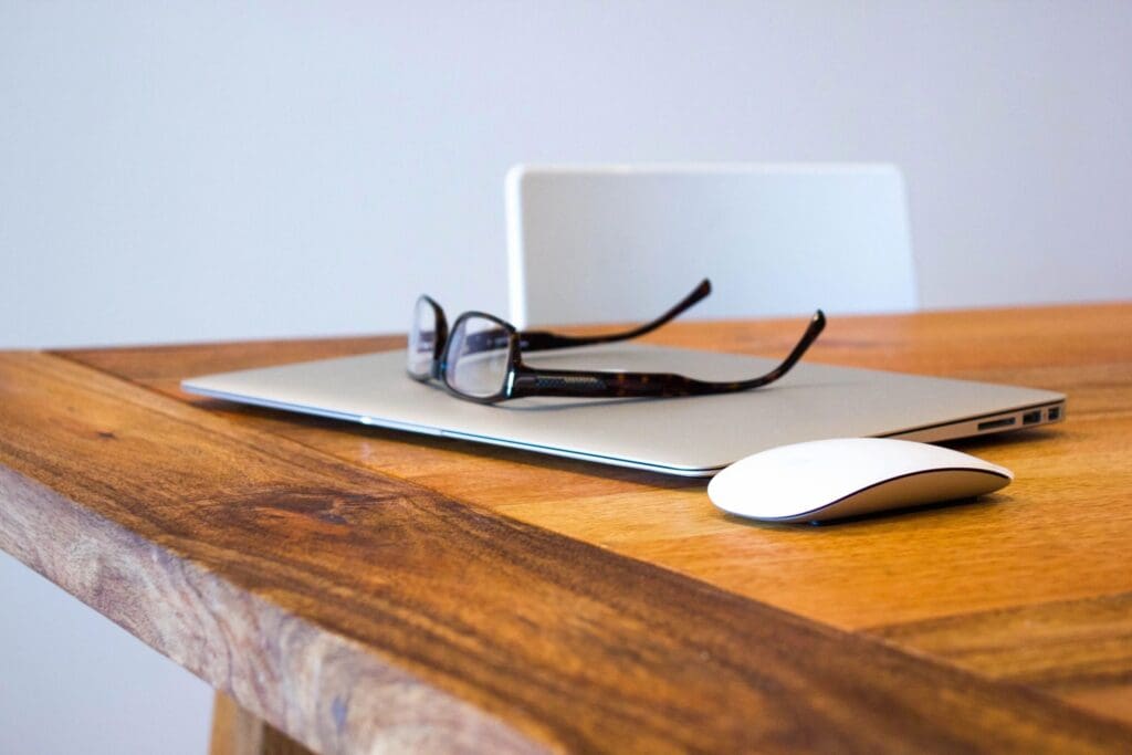 Laptop and mouse on a table